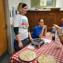 Friends serving pie